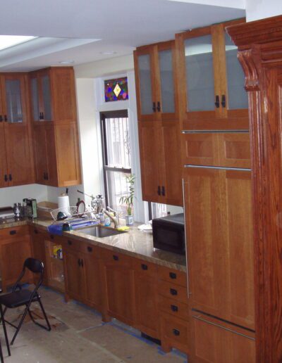 A spacious kitchen with wooden cabinets and modern appliances.